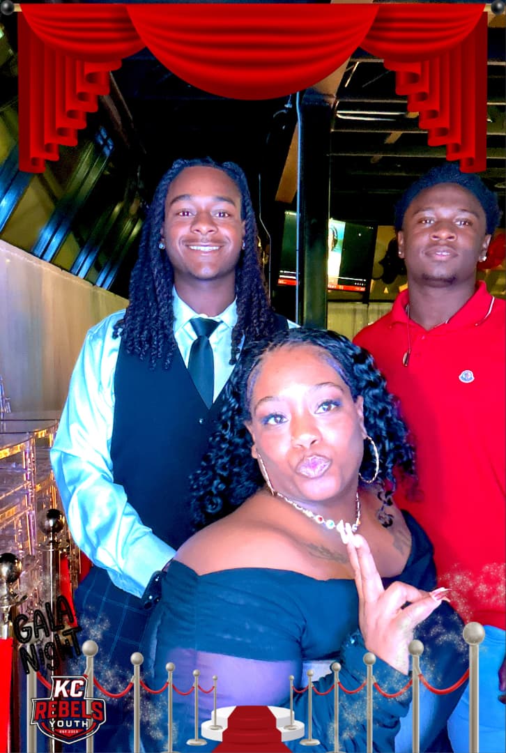 KC Rebels supporters at a formal community event